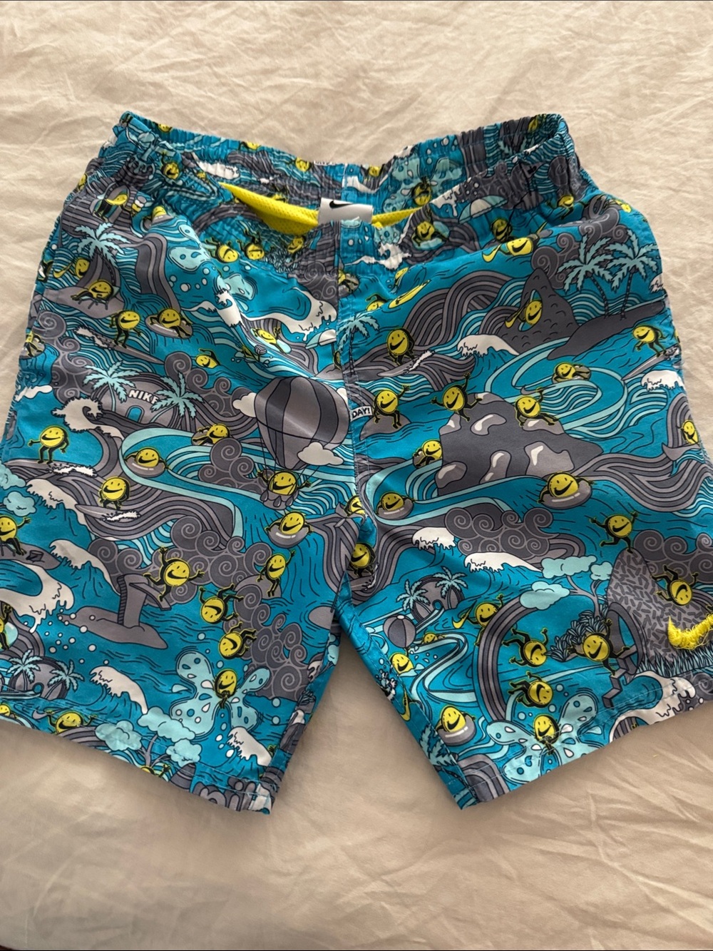 Nike boys Teal Blue Graphic Swim Shorts with Yellow Accents